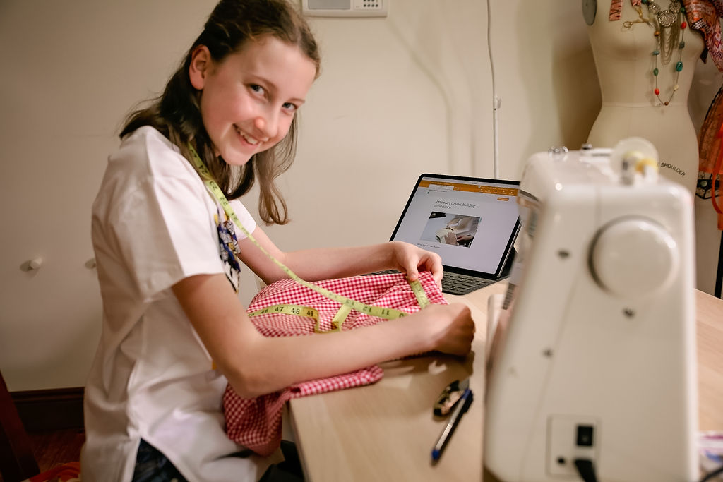 Girl enjoying sewing
